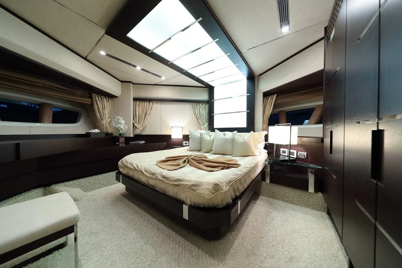 a large bedroom with a bed aboard PATRONESS Yacht for Sale