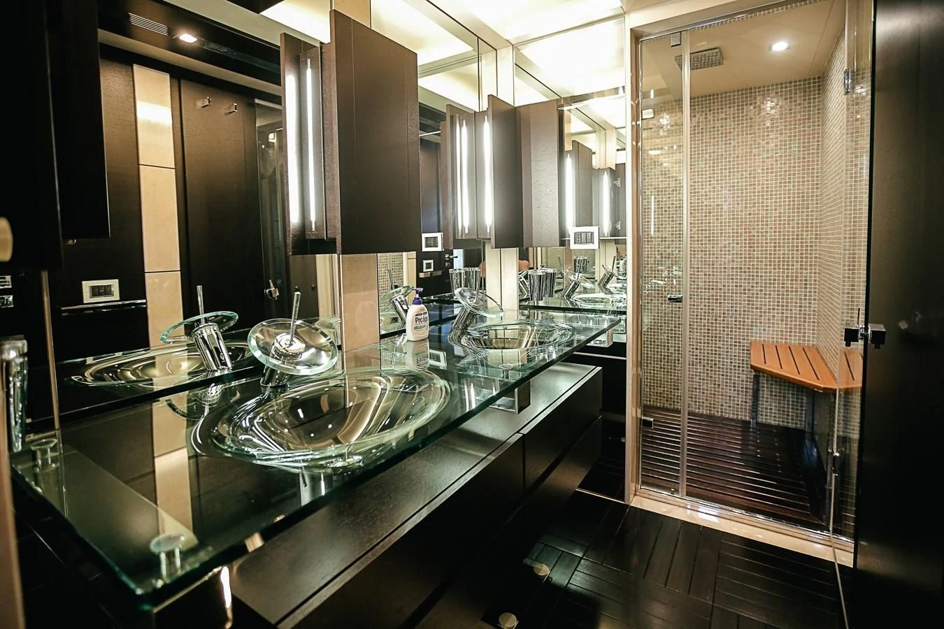 a large kitchen with glass counter tops aboard PATRONESS Yacht for Sale