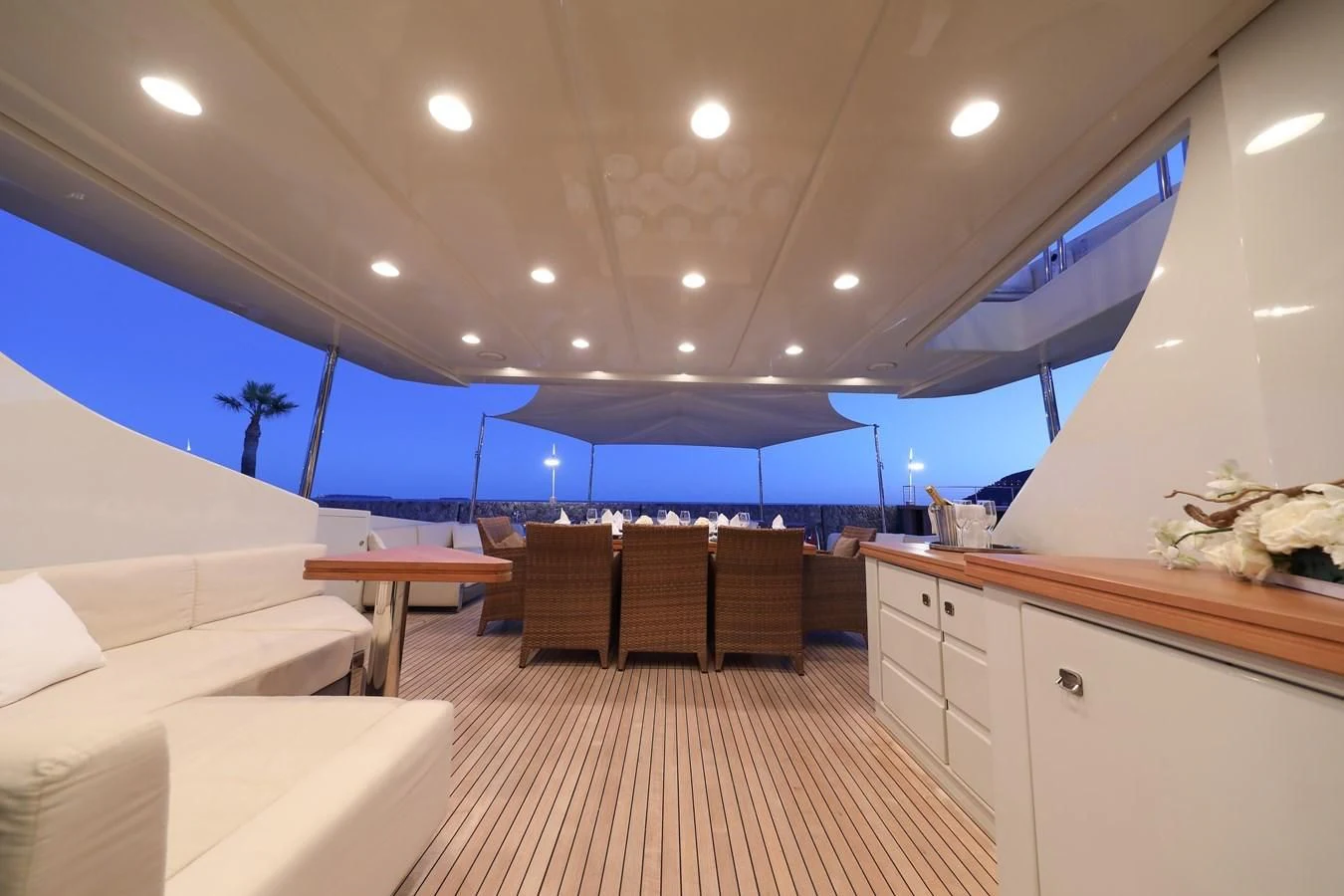a room with a bed and a table and chairs aboard PATRONESS Yacht for Sale