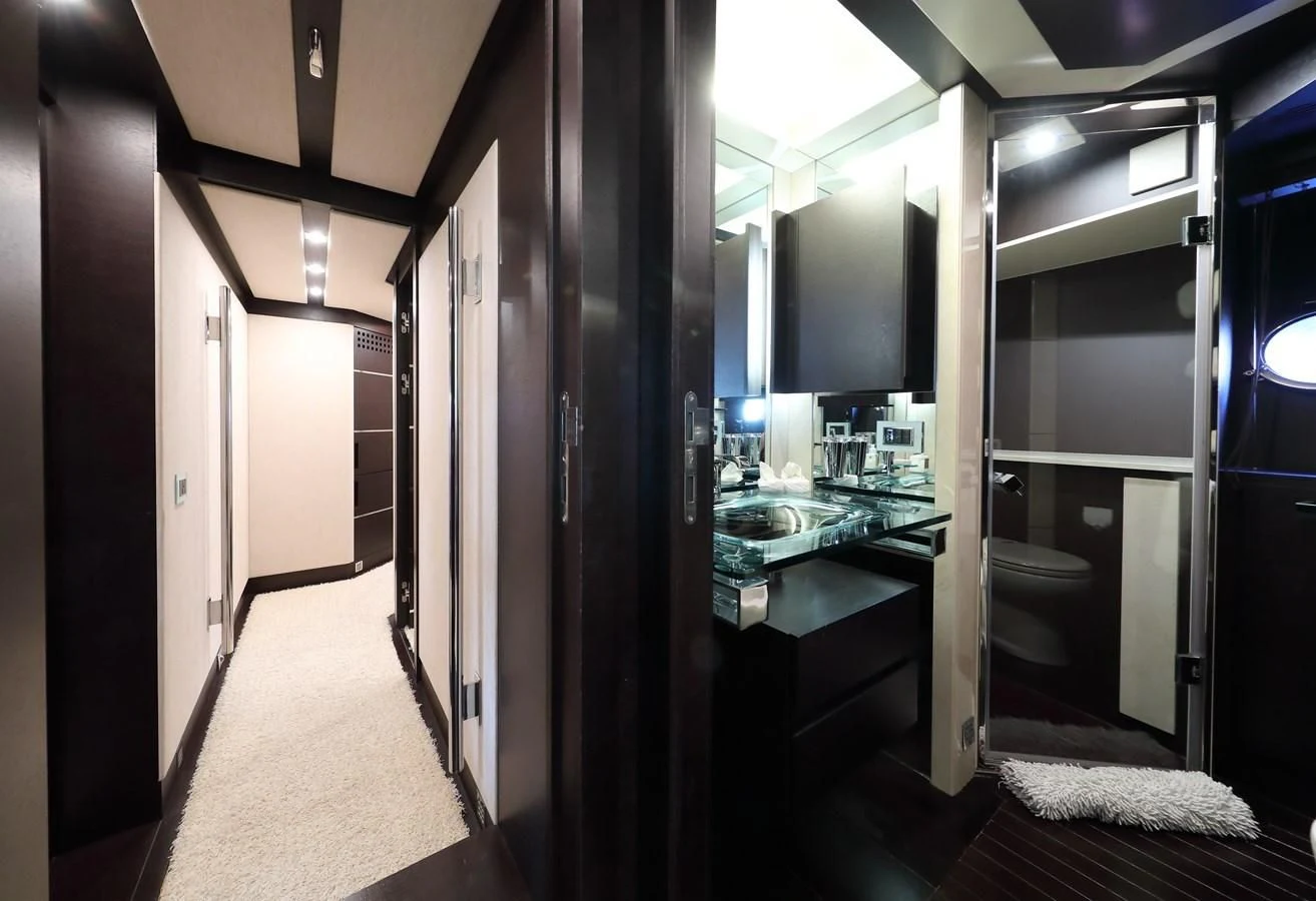a hallway with a glass door aboard PATRONESS Yacht for Sale