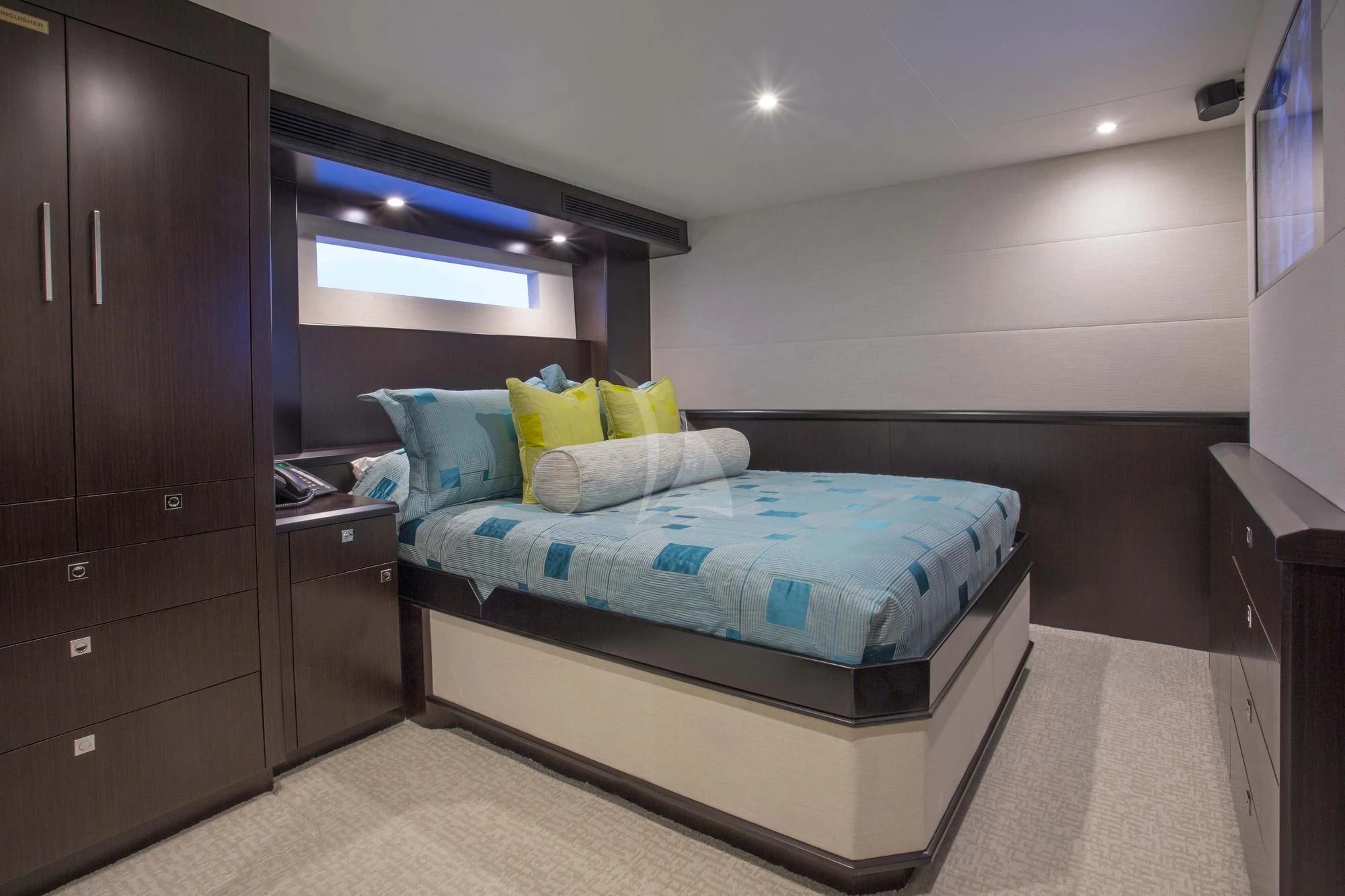 a bedroom with a bed and a dresser aboard LADY CARMEN Yacht for Sale