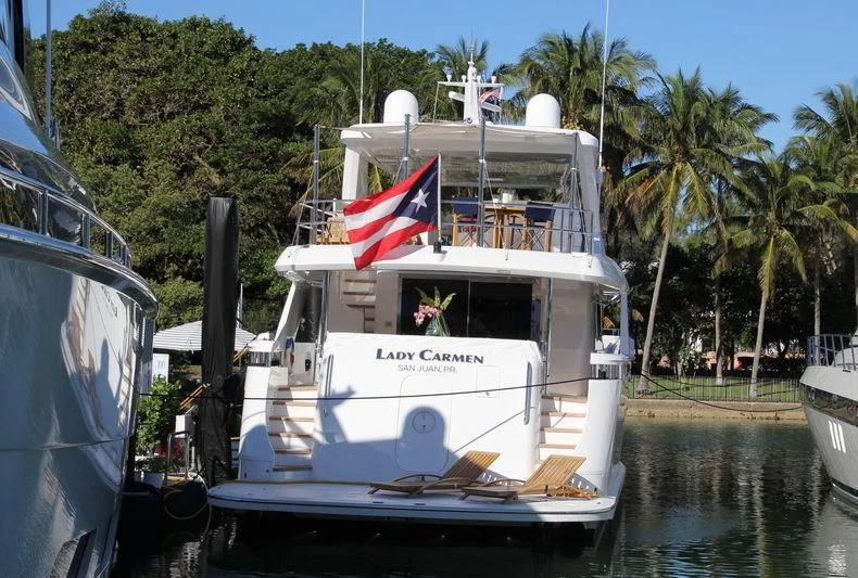 a boat with a flag on the front aboard LADY CARMEN Yacht for Sale