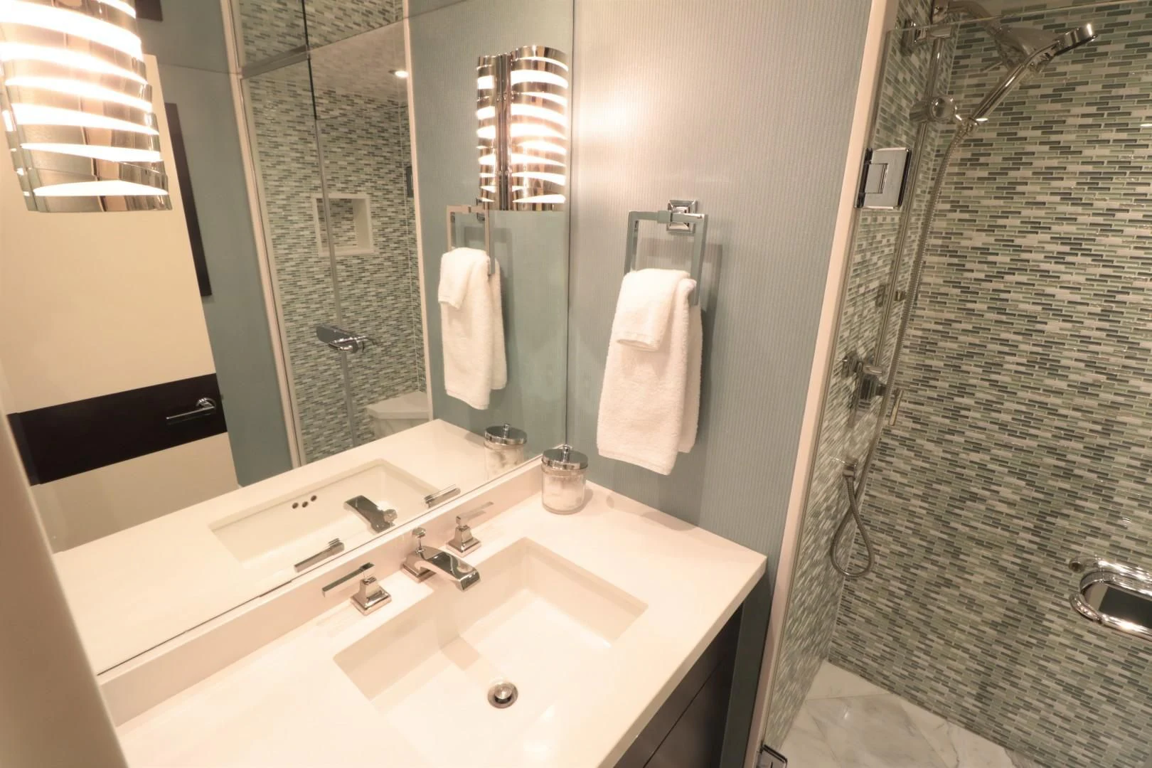 a bathroom with a sink and a shower curtain aboard LADY CARMEN Yacht for Sale