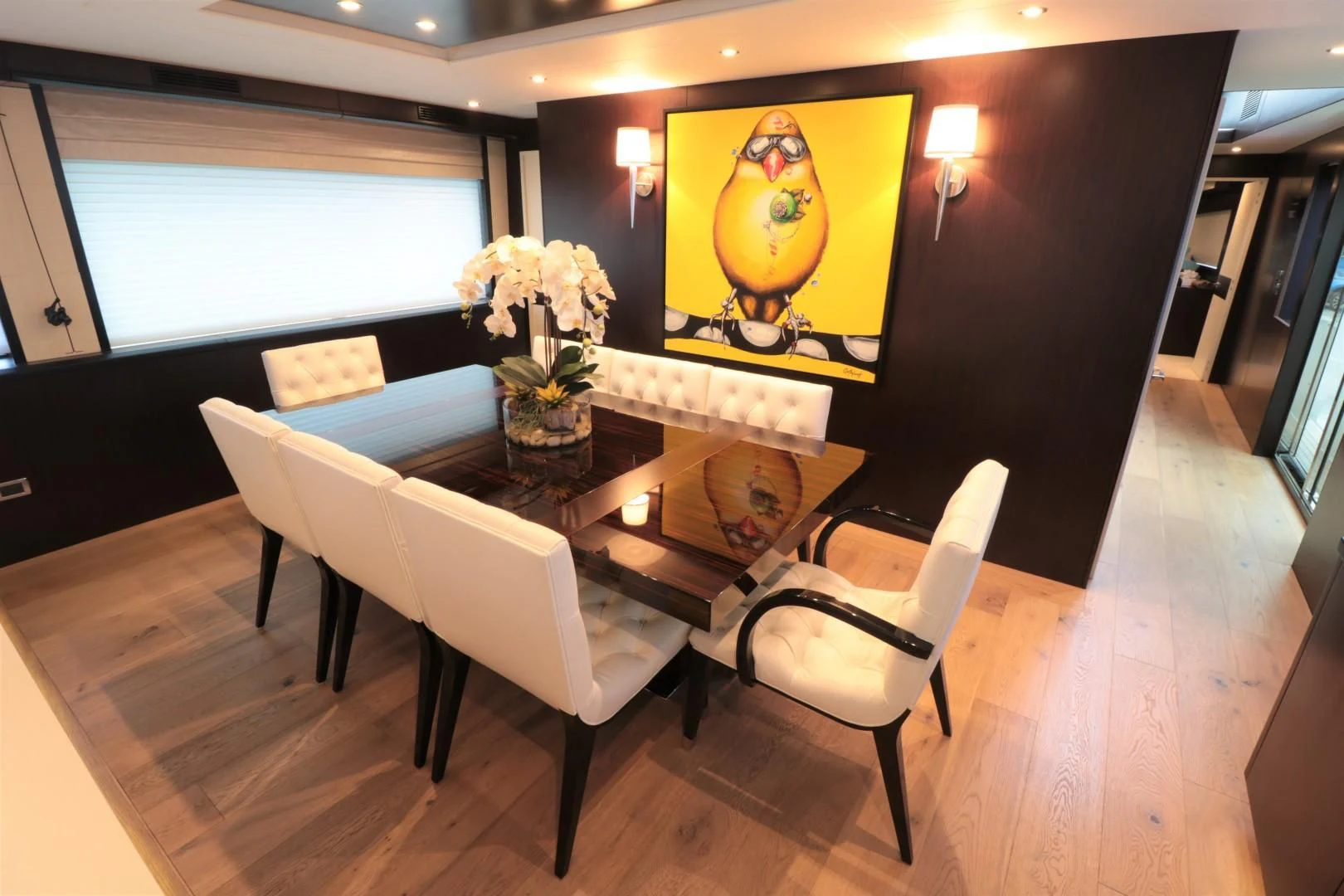 a room with a table and chairs aboard LADY CARMEN Yacht for Sale