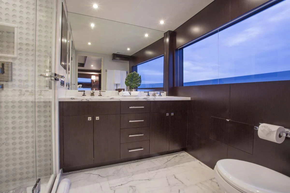 a bathroom with a large mirror aboard LADY CARMEN Yacht for Sale