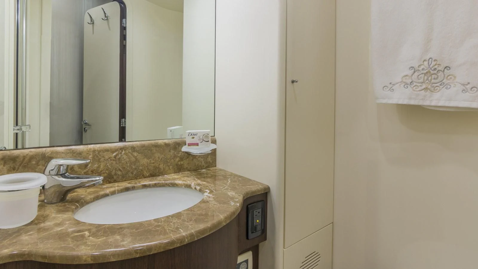 a bathroom with a sink and a mirror aboard NEXT Yacht for Sale