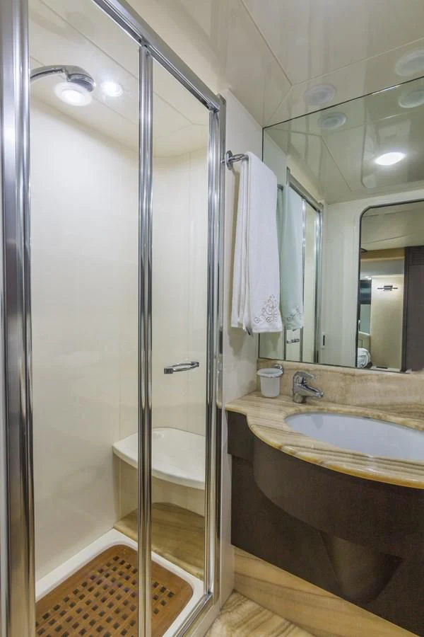 a bathroom with a glass shower aboard NEXT Yacht for Sale