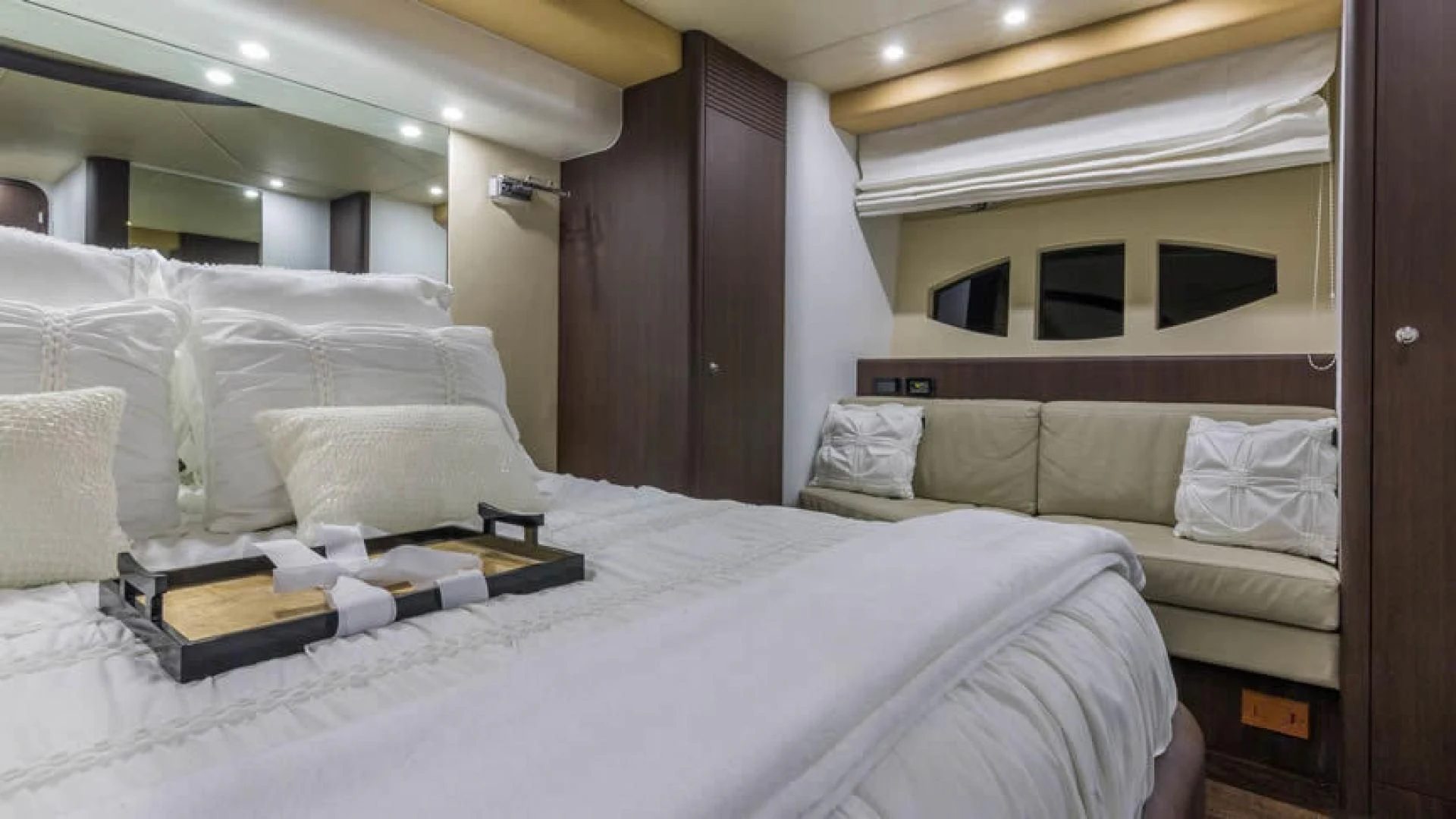 a bed with white sheets aboard NEXT Yacht for Sale
