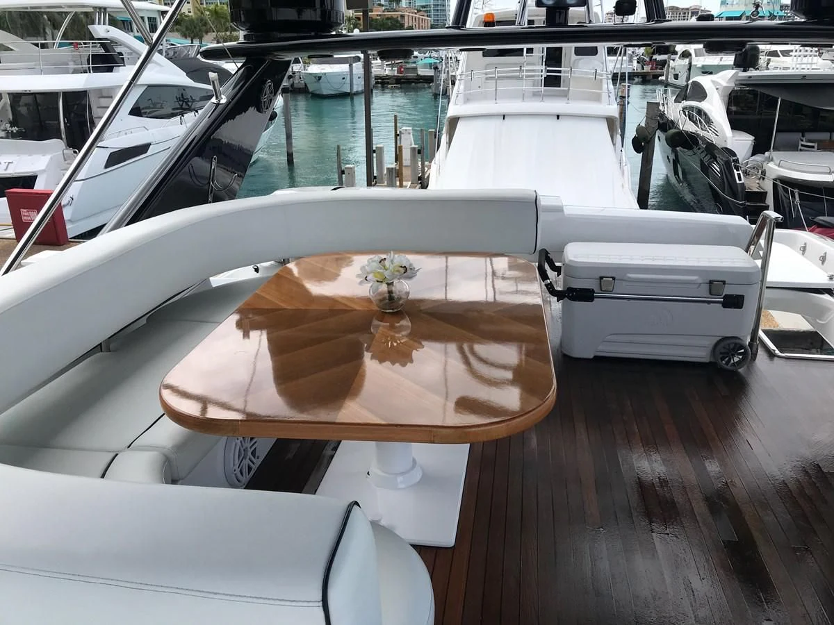 a boat with a table and chairs aboard NEXT Yacht for Sale