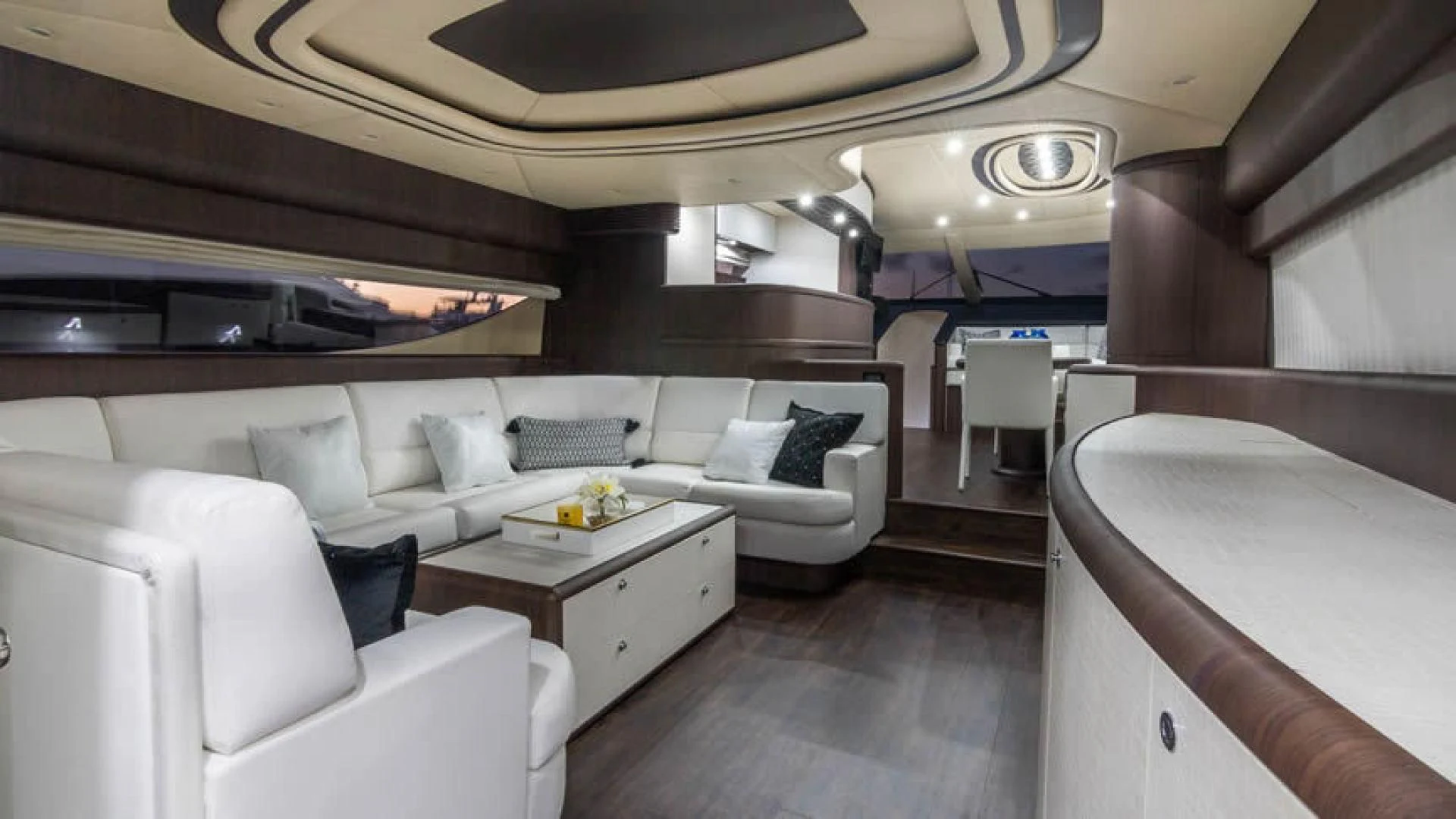 a room with a couch and a table aboard NEXT Yacht for Sale
