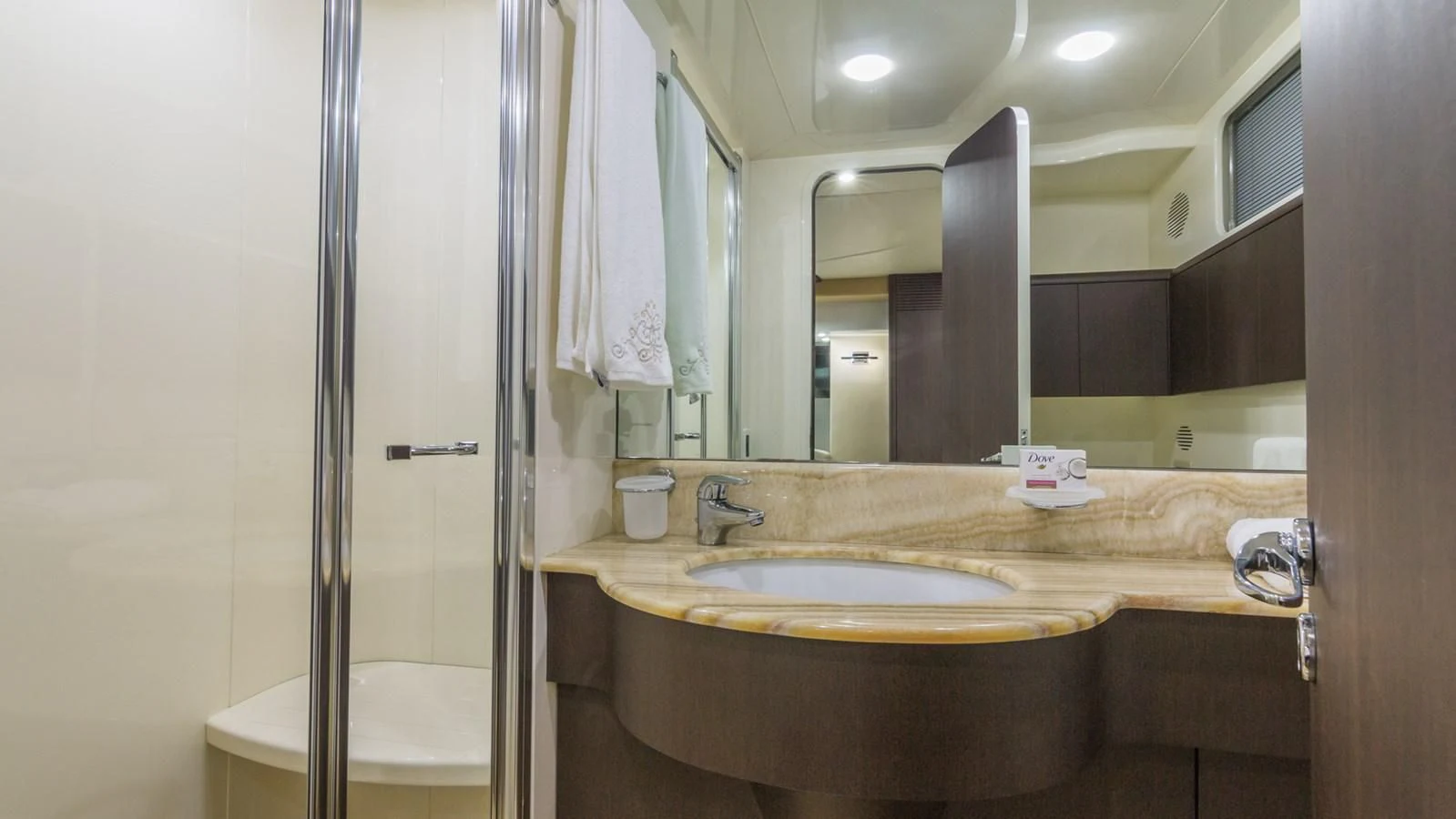 a bathroom with a large mirror aboard NEXT Yacht for Sale