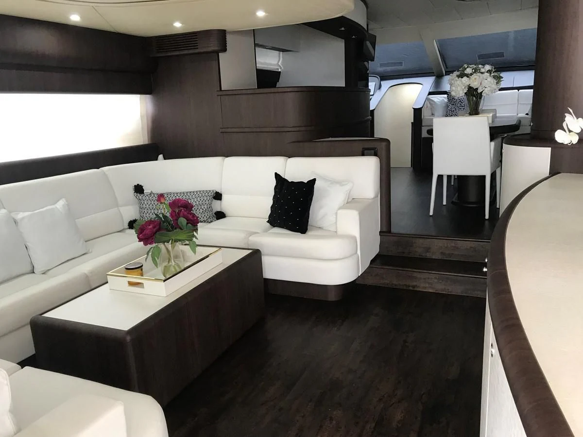 a living room with a white couch and a table aboard NEXT Yacht for Sale
