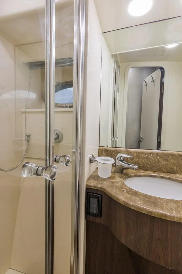 a bathroom with a glass shower aboard NEXT Yacht for Sale
