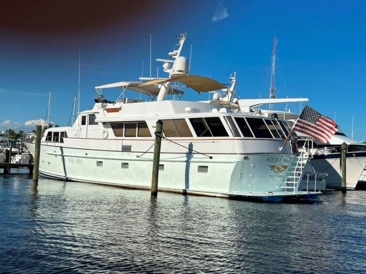 a large white boat in the water aboard MISS WENDY Yacht for Sale