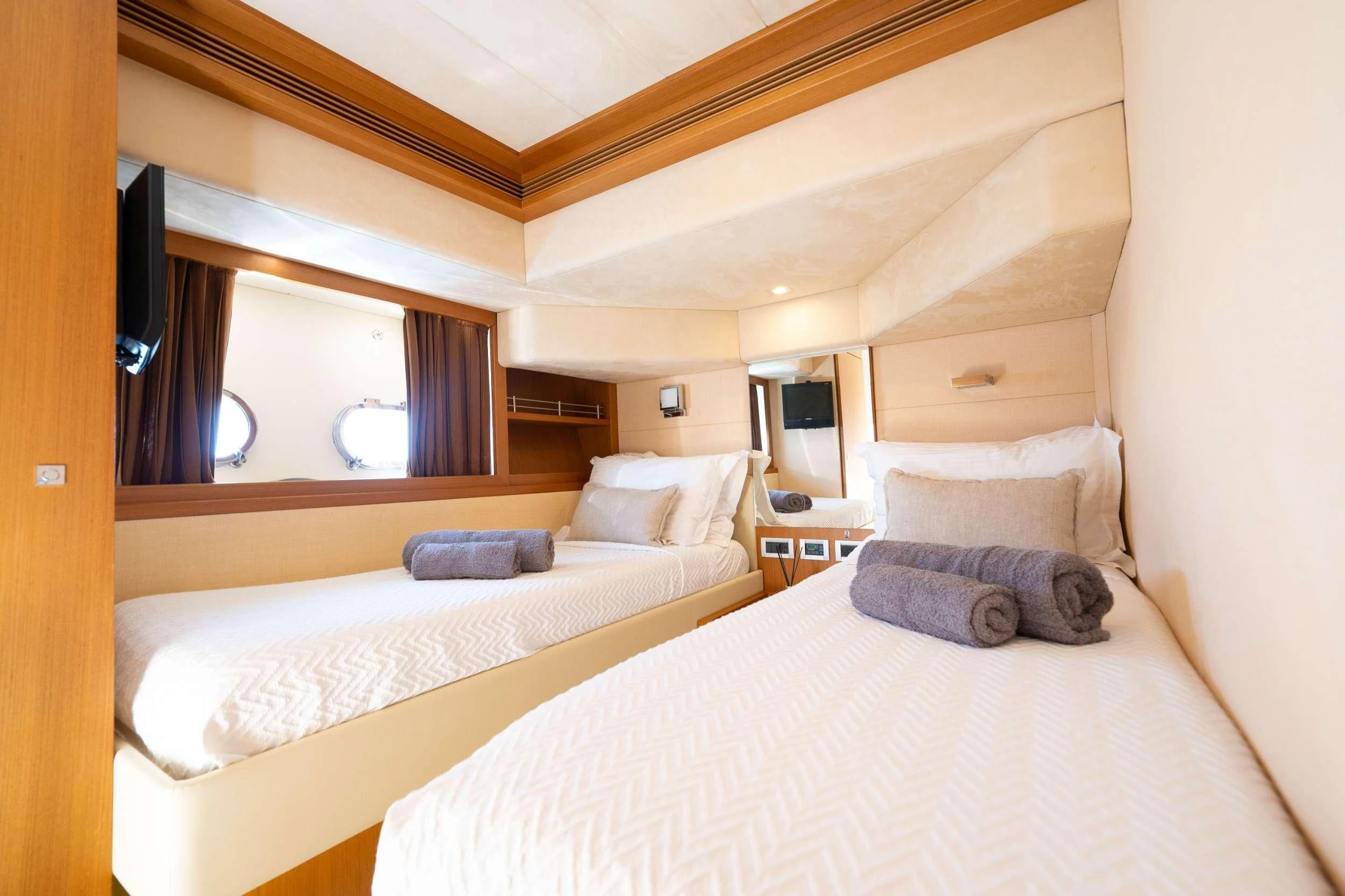 a room with two beds aboard NINETEEN Yacht for Charter