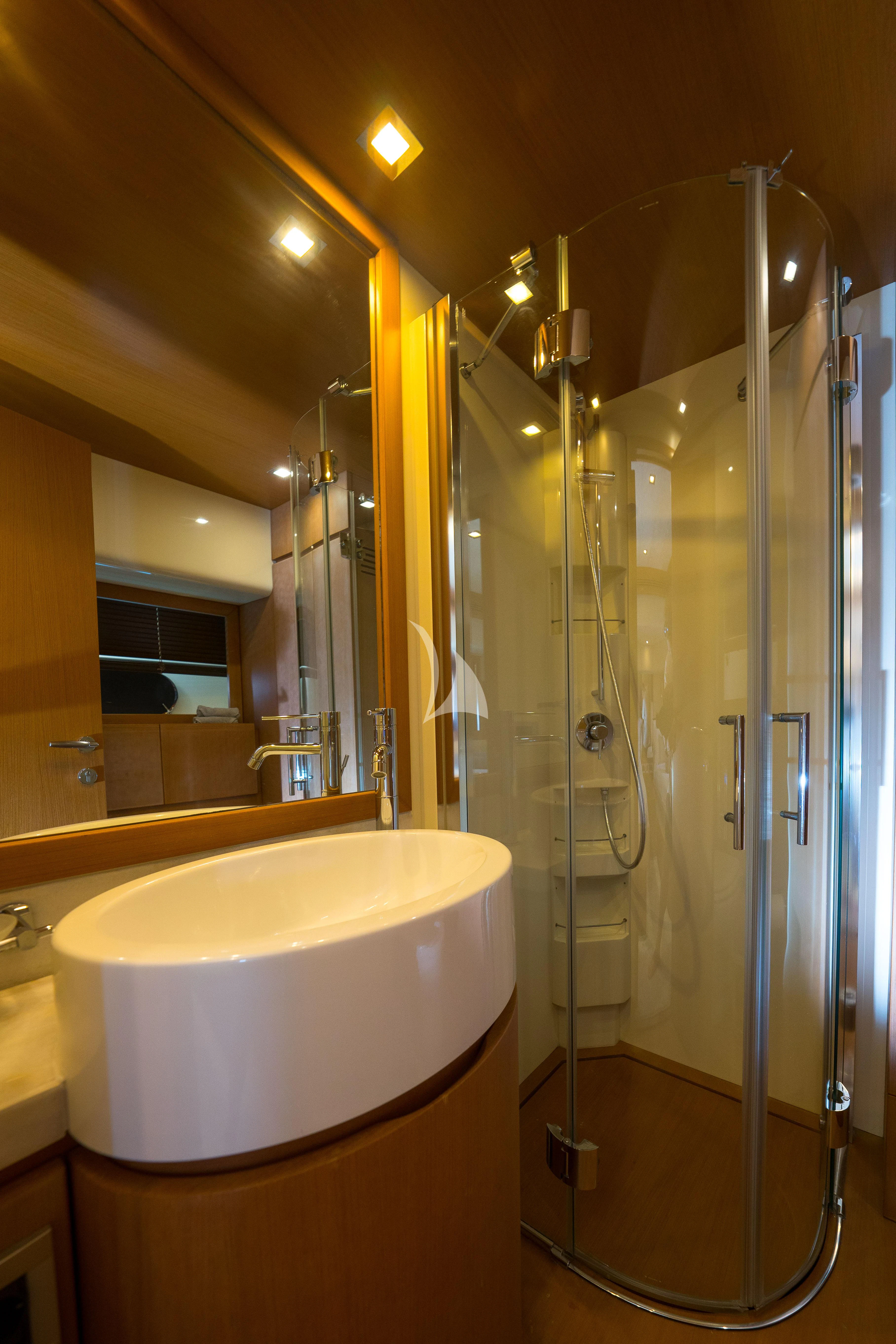 a bathroom with a glass shower aboard NINETEEN Yacht for Charter