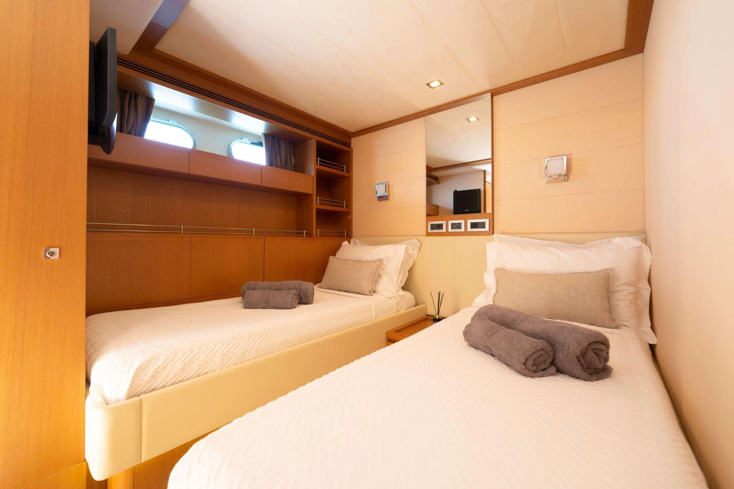 a couple of beds in a room aboard NINETEEN Yacht for Charter