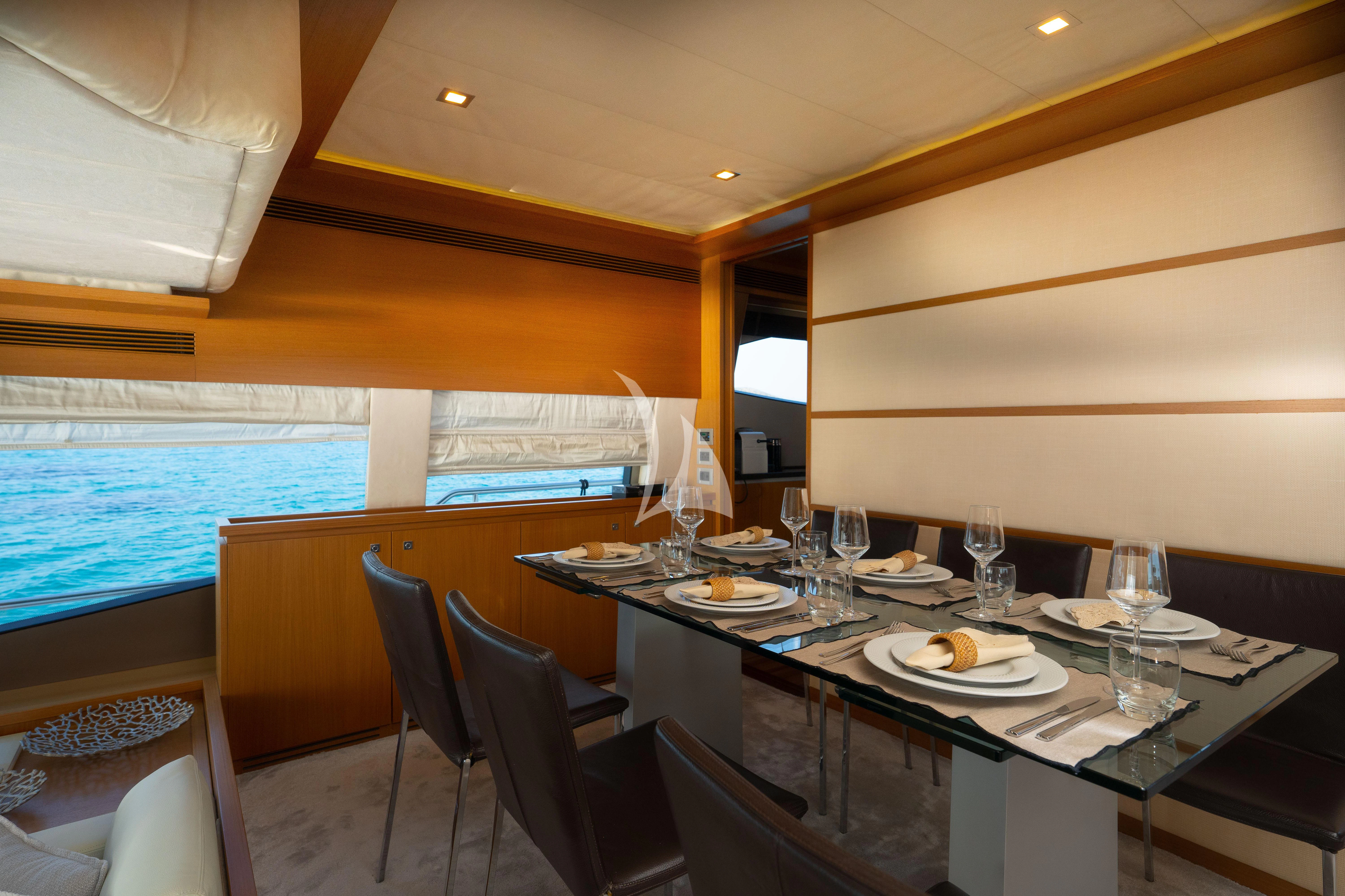 a table with plates and glasses on it aboard NINETEEN Yacht for Charter