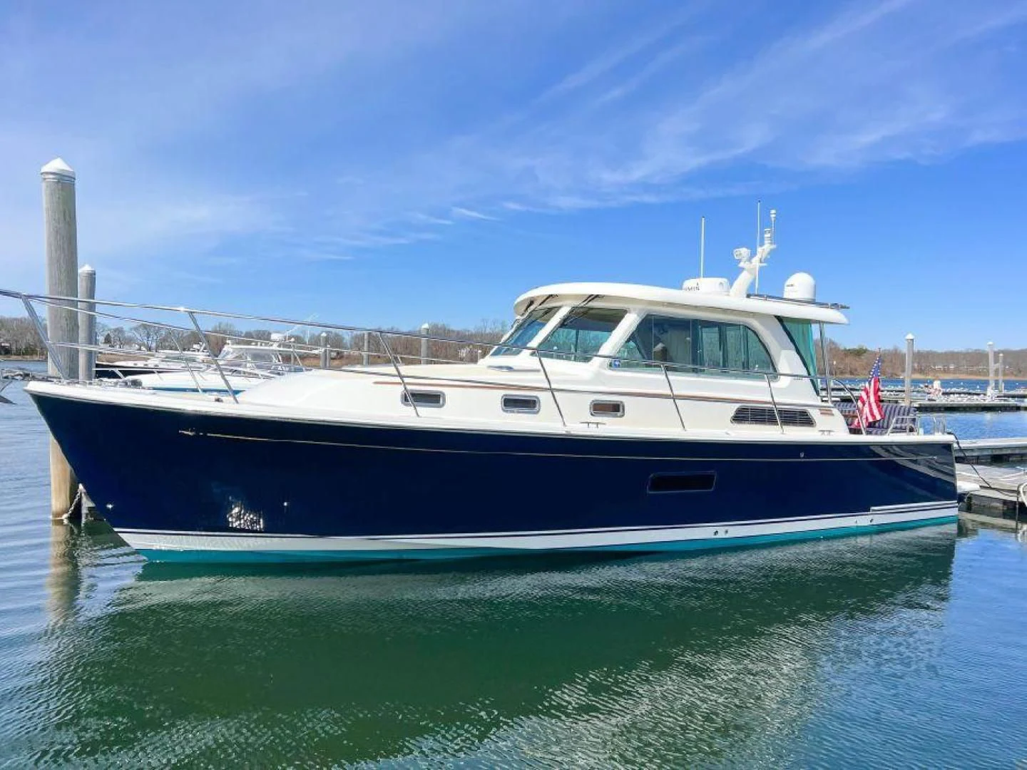 a boat docked at a pier aboard NINETEEN Yacht for Charter