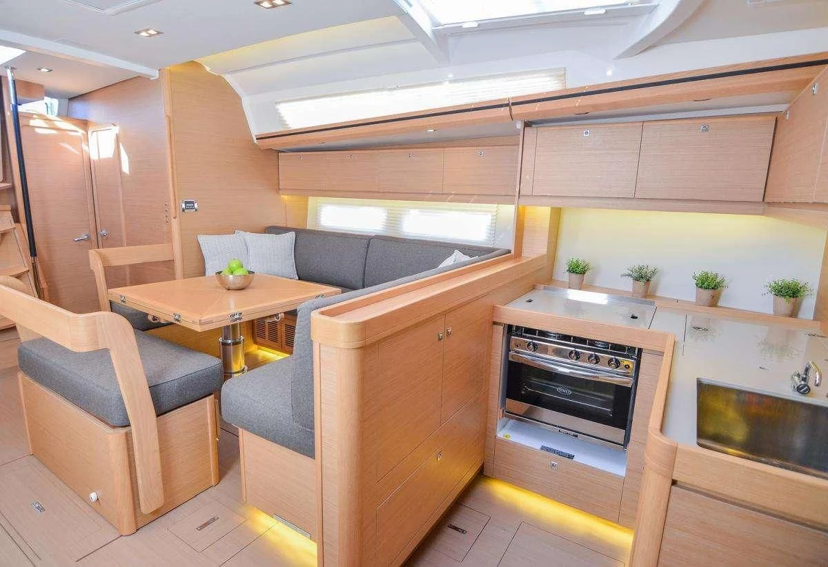 a kitchen with a table and chairs aboard NINETEEN Yacht for Charter