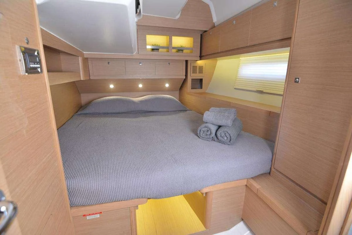 a bed in a room aboard NINETEEN Yacht for Charter