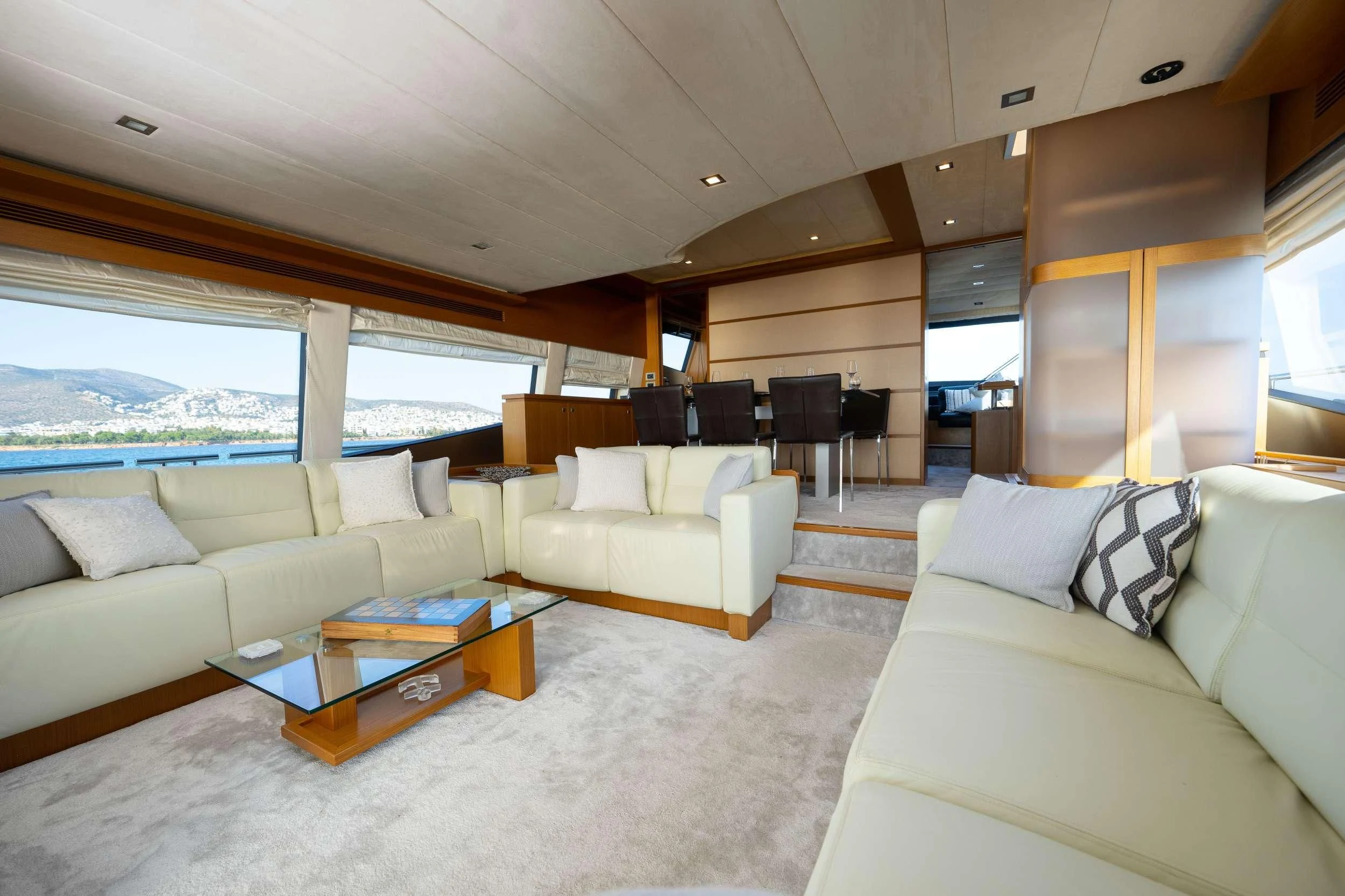 a living room with a couch and a table aboard NINETEEN Yacht for Charter