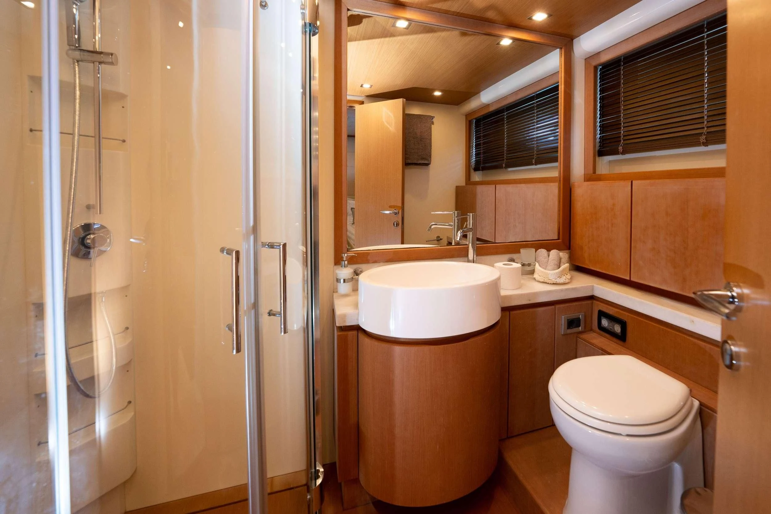 a bathroom with a toilet and a sink aboard NINETEEN Yacht for Charter