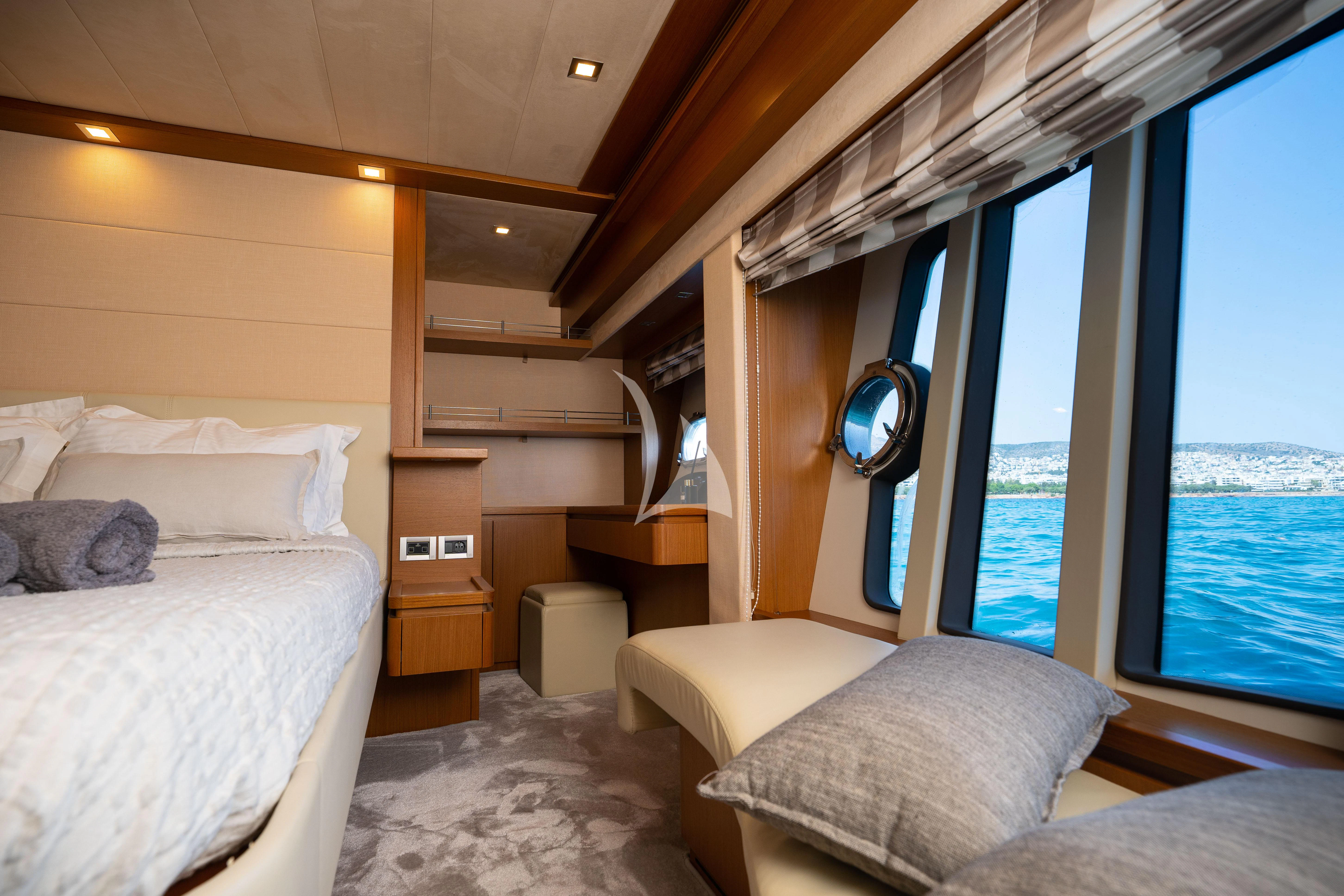 a room with a bed and a window aboard NINETEEN Yacht for Charter
