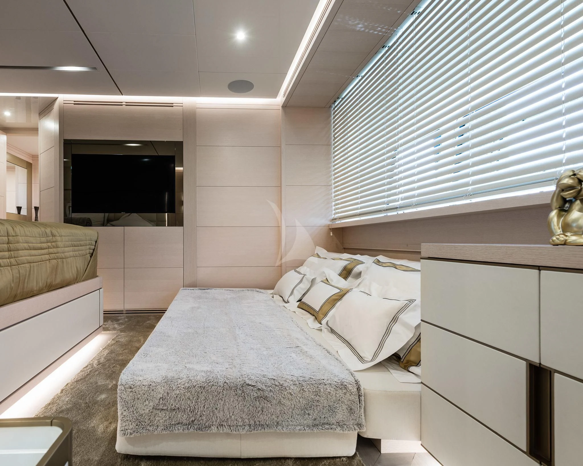 a room with a bed and a television aboard KIMOJO Yacht for Sale