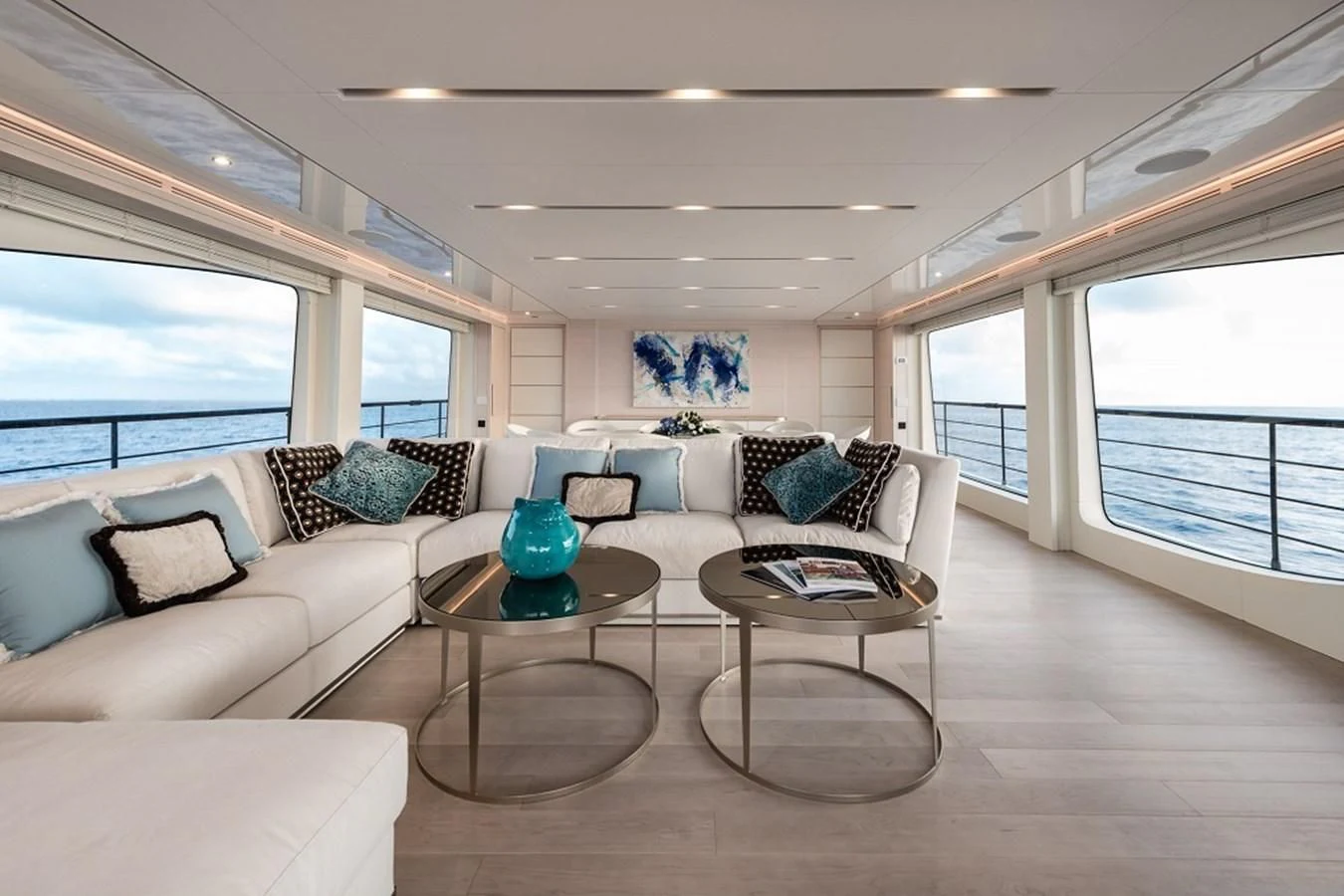 a living room with a large window aboard KIMOJO Yacht for Sale