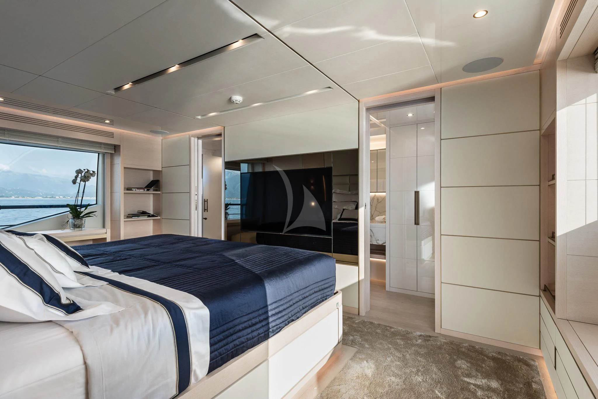 a bedroom with a large bed aboard KIMOJO Yacht for Sale