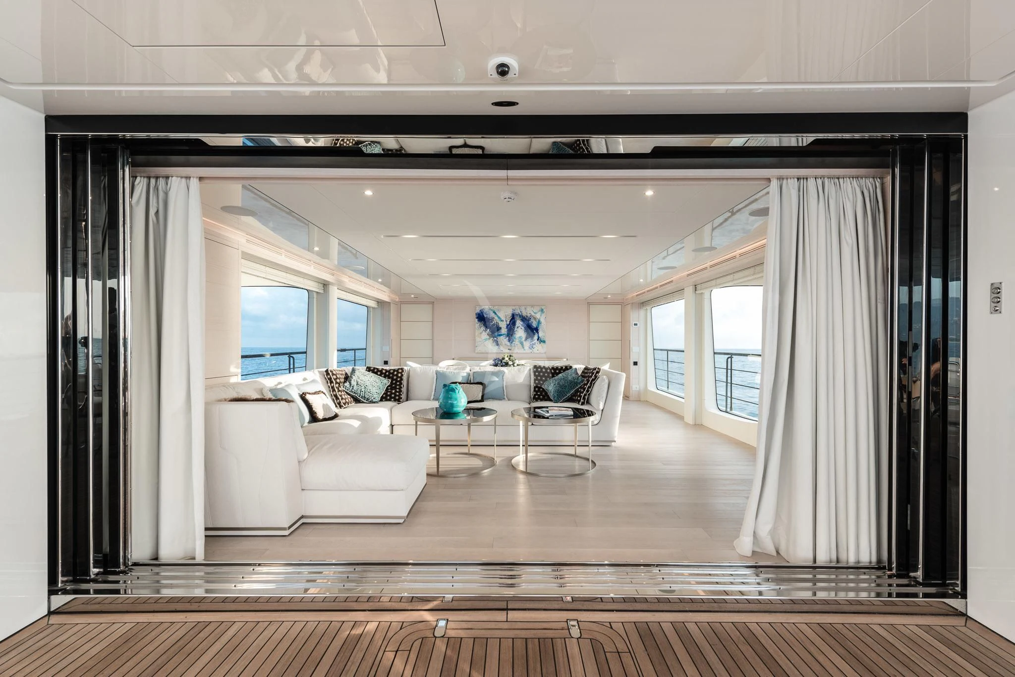 a living room with a wood floor aboard KIMOJO Yacht for Sale
