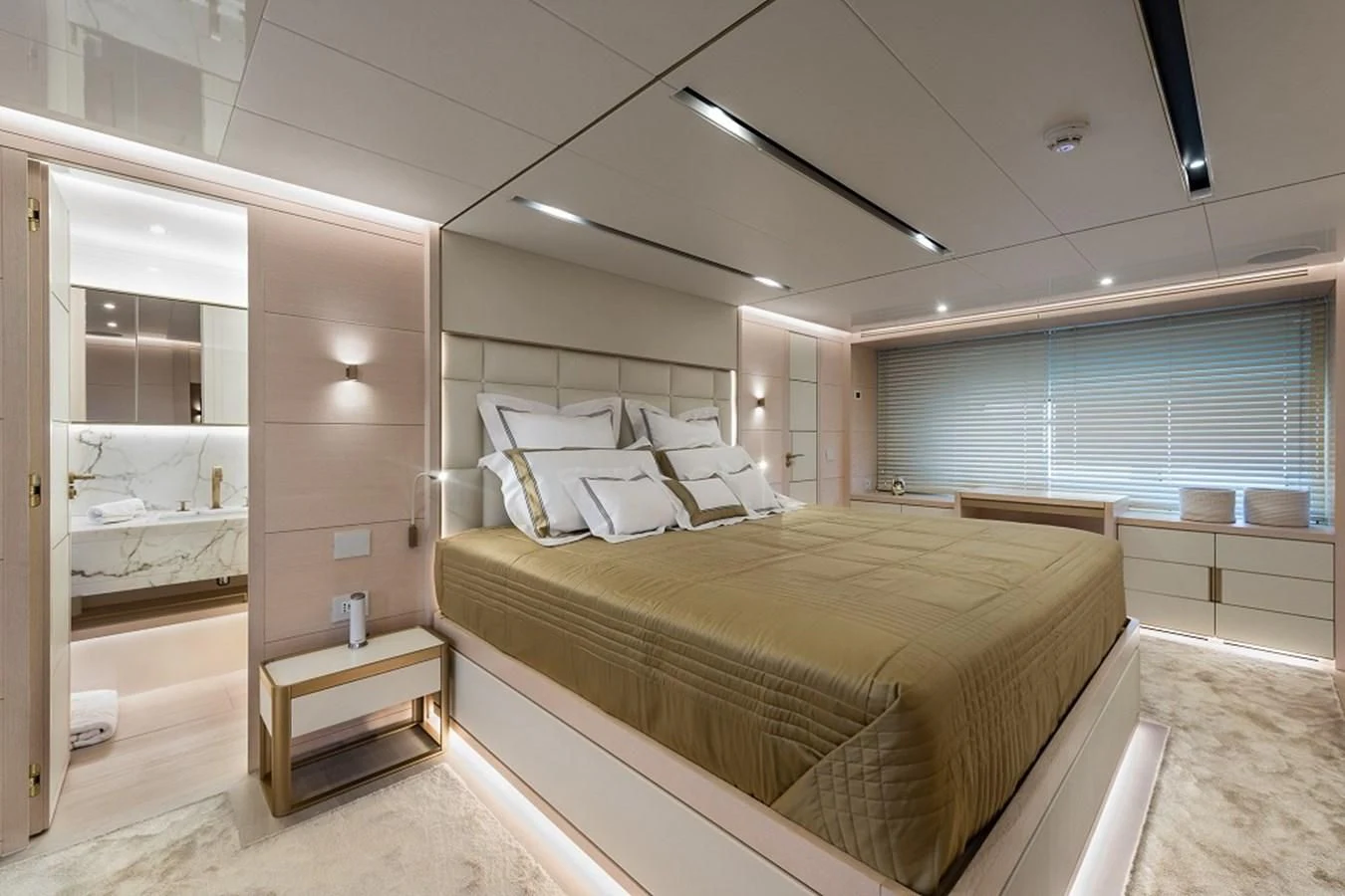a room with a bed and a mirror aboard KIMOJO Yacht for Sale