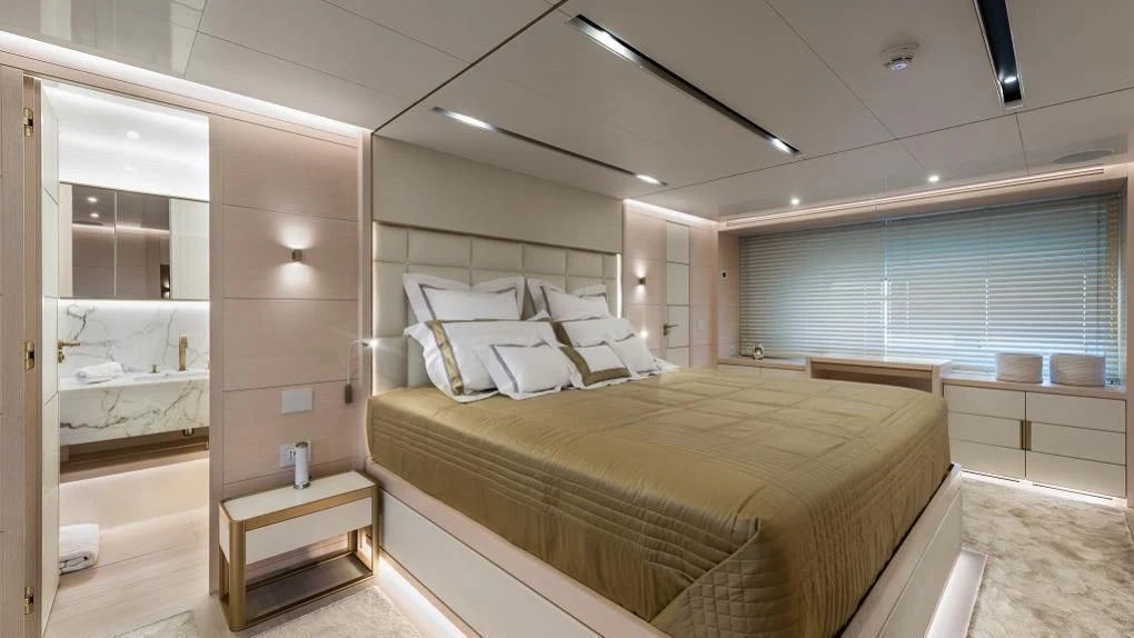 a large bedroom with a large bed aboard KIMOJO Yacht for Sale