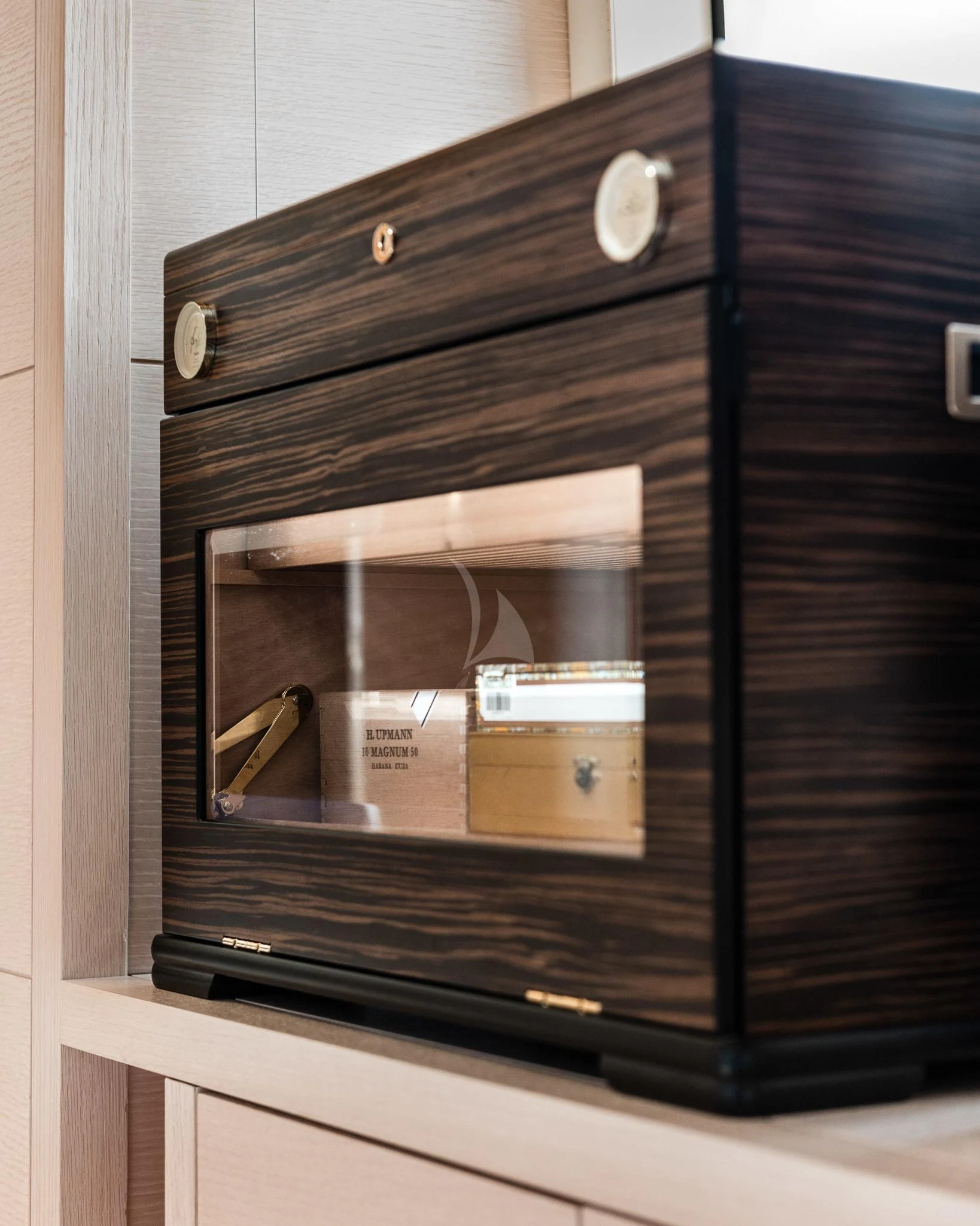 a black cabinet with a white door aboard KIMOJO Yacht for Sale
