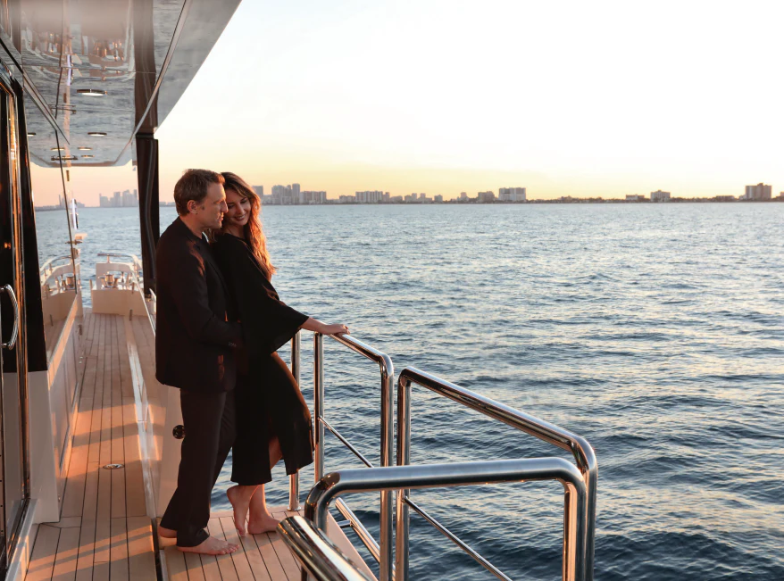 a man and woman kissing on a boat aboard NIRVANA II Yacht for Sale