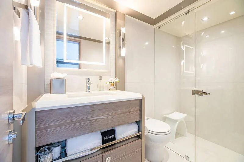 a bathroom with a sink toilet and a mirror aboard NIRVANA II Yacht for Sale