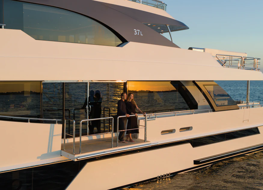 a group of people standing on a balcony of a boat aboard NIRVANA II Yacht for Sale