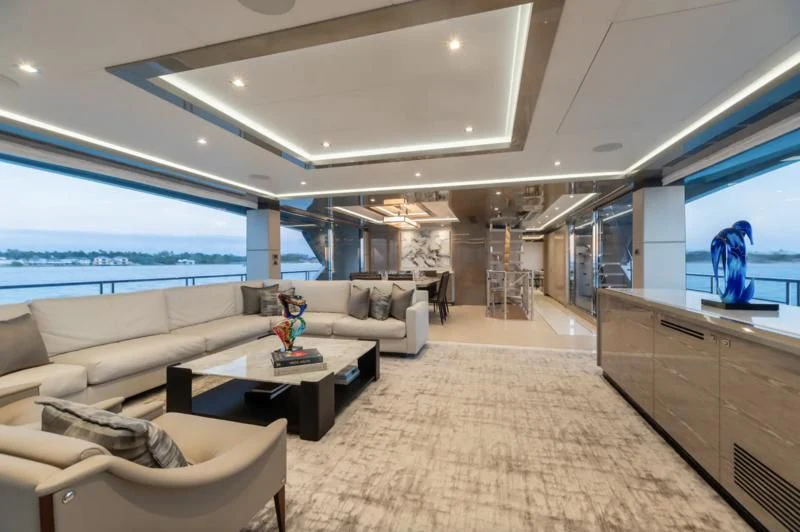 a living room with a large window aboard NIRVANA II Yacht for Sale