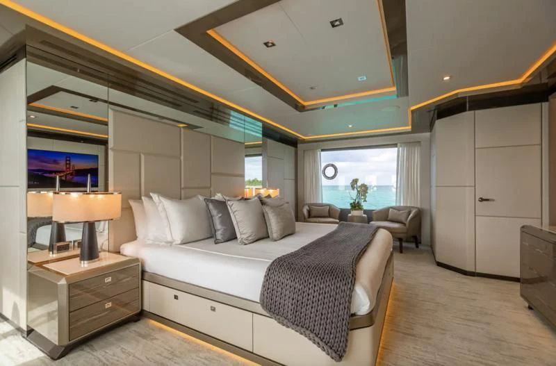 a large bedroom with a bed aboard NIRVANA II Yacht for Sale