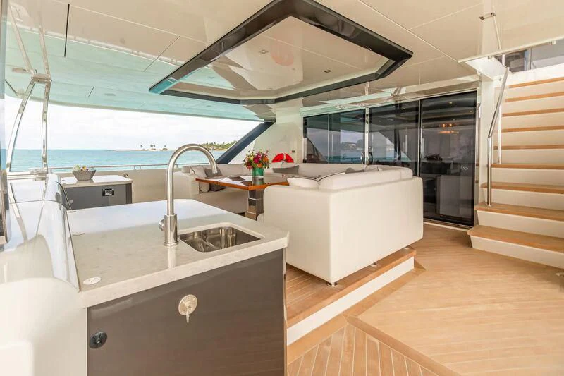 a modern kitchen with a large glass window aboard NIRVANA II Yacht for Sale