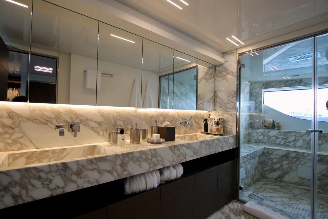 a bathroom with a large mirror aboard WILLPOWER Yacht for Sale