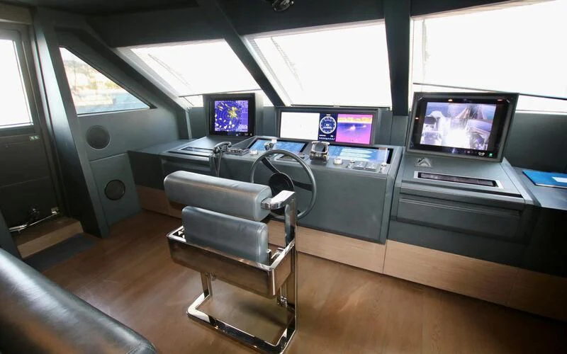 a room with a desk and chairs aboard WILLPOWER Yacht for Sale