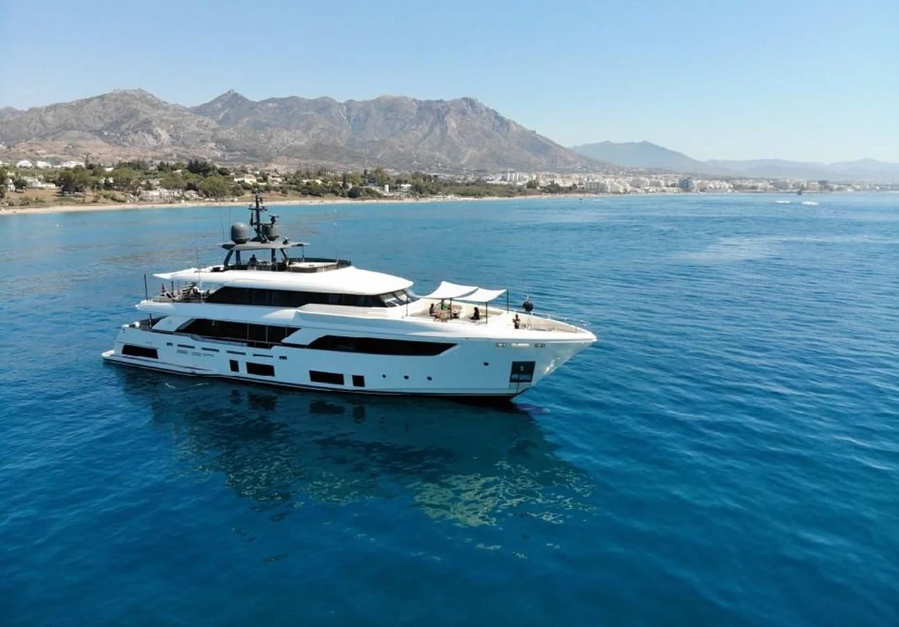 a white yacht in the water aboard WILLPOWER Yacht for Sale