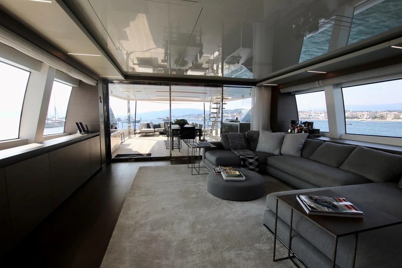 a living room with a large window aboard WILLPOWER Yacht for Sale