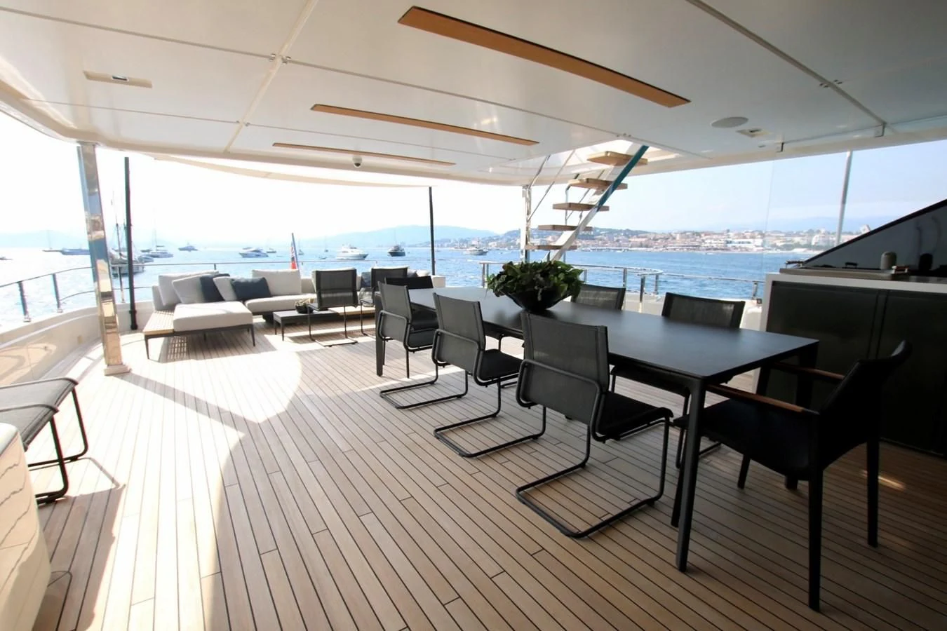 a room with a table and chairs aboard WILLPOWER Yacht for Sale