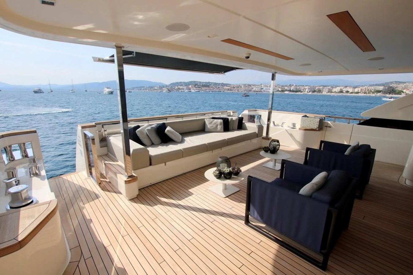 a large lounge area with a large body of water in the background aboard WILLPOWER Yacht for Sale