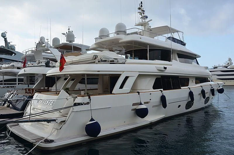 a boat docked at a pier aboard MANTA Yacht for Sale