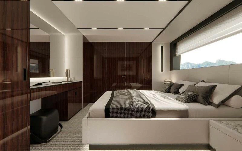 a room with a bed and a desk aboard JANUS NAVEM Yacht for Sale