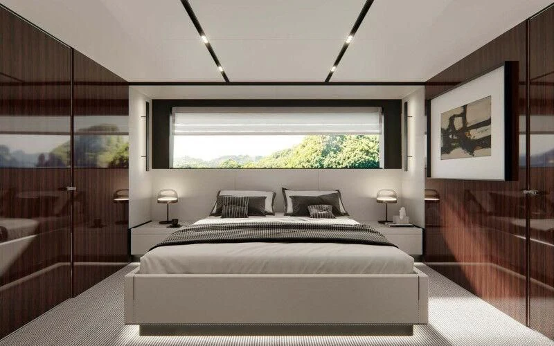 a bedroom with a large bed aboard JANUS NAVEM Yacht for Sale